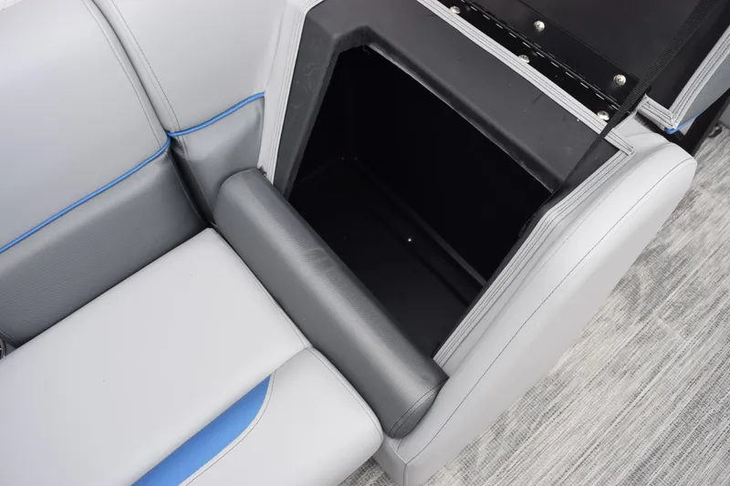 Slide: The Image of 2026 Bentley Pontoons Bolt 223 interior storage compartment with gray and blue seating. - 16
