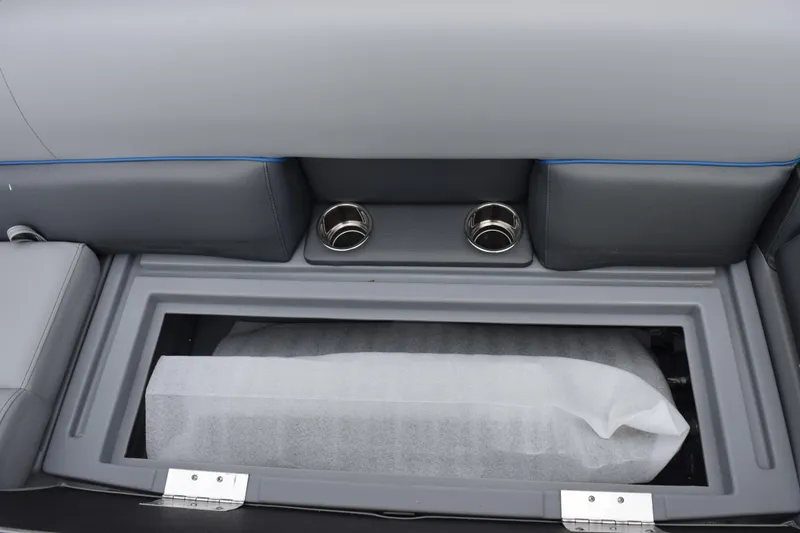 Slide: The Image of 2026 Bentley Pontoons Bolt 223 interior storage compartment with cup holders and sleek design. - 17