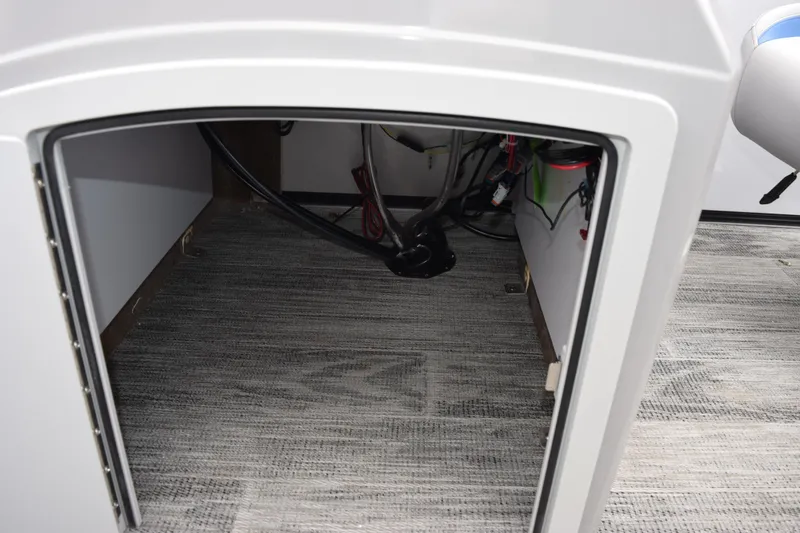 Slide: The Image of Interior view of 2026 Bentley Pontoons Bolt 223 storage compartment with wiring. - 19