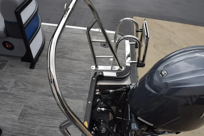 Slide: The Image of 2026 Bentley Pontoons Bolt 223 with sleek motor and stainless steel ladder. - 20