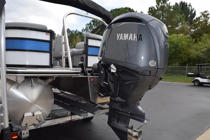 Slide: The Image of 2026 Bentley Pontoons Bolt 223 with Yamaha outboard motor, parked outdoors. - 6