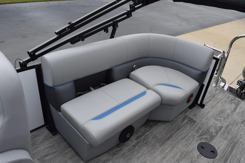 Slide: The Image of 2026 Bentley Pontoons Bolt 223 interior seating with gray upholstery and blue accents. - 8