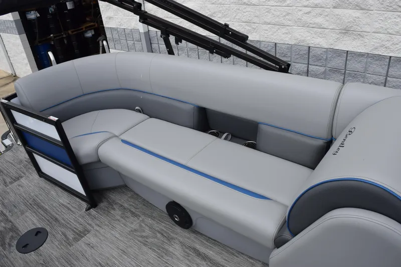 Slide: The Image of 2026 Bentley Pontoons Bolt 223 interior with gray seating and blue accents. - 9