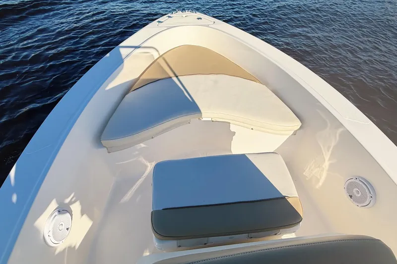 Slide: The Image of 2019 Pioneer 175 Baysport boat interior with cushioned seating on calm water. - 4