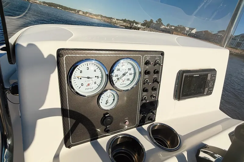 Slide: The Image of 2019 Pioneer 175 Baysport dashboard with gauges and Garmin device on a sunny day. - 8