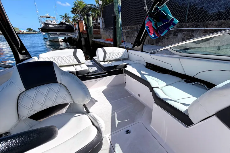 Slide: The Image of 2020 Regal 2300 Bowrider interior with luxurious seating and waterfront view. - 12