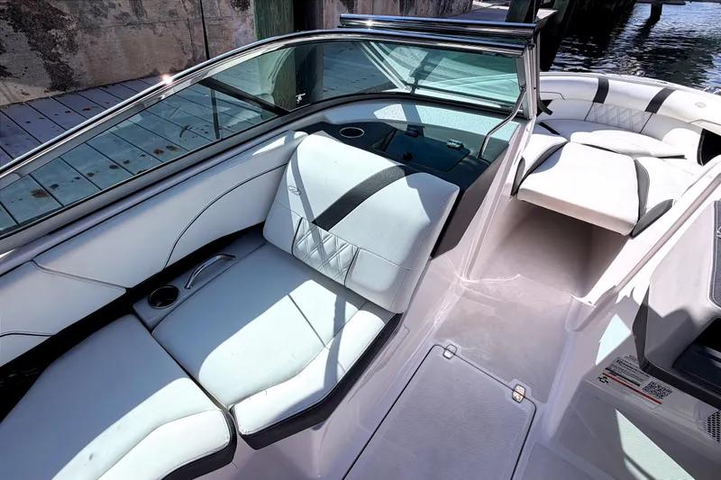 Slide: The Image of 2020 Regal 2300 Bowrider interior with white seating and sleek design. - 13
