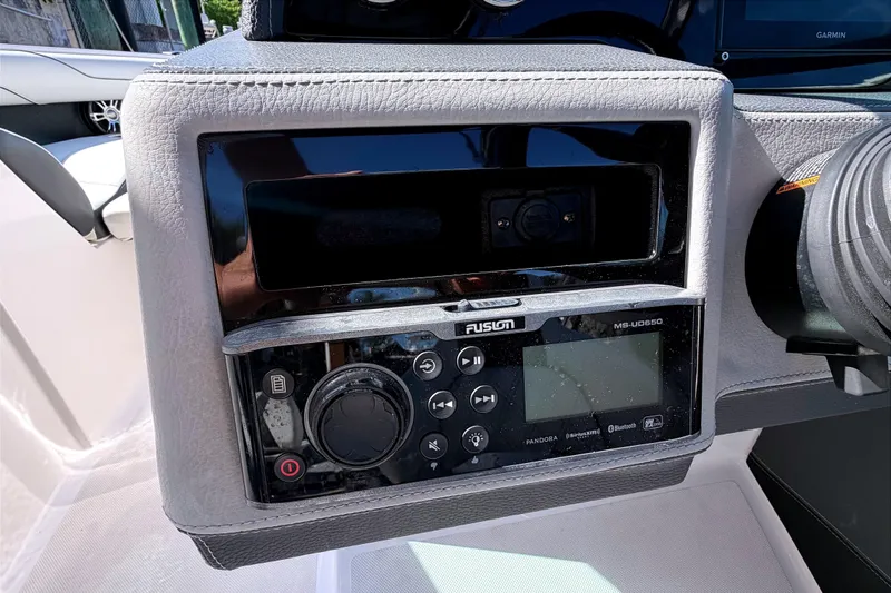Slide: The Image of 2020 Regal 2300 Bowrider dashboard with Fusion MS-UD650 audio system. - 18
