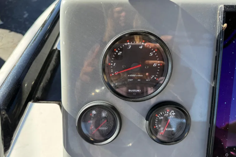 Slide: The Image of Dashboard of 2022 Shoalwater 23 Catamaran with Suzuki gauges and controls. - 12