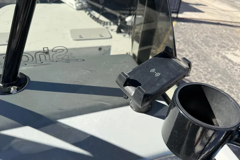 Slide: The Image of Dashboard of 2022 Shoalwater 23 Catamaran with phone holder and cup holder. - 19