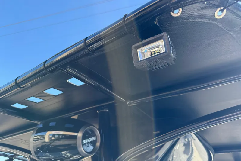 Slide: The Image of 2022 Shoalwater 23 Catamaran with Kicker speaker and LED light under canopy. - 22