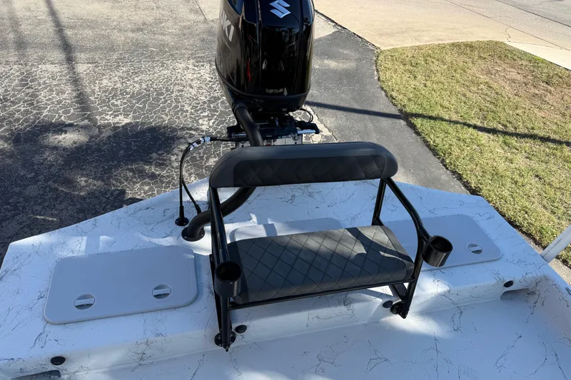 Slide: The Image of 2022 Shoalwater 23 Catamaran with Suzuki outboard motor and seating on deck. - 27