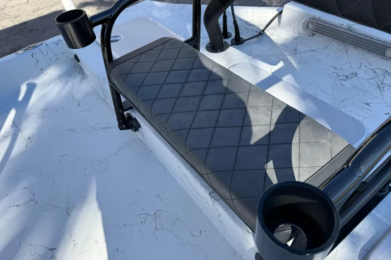 Slide: The Image of 2022 Shoalwater 23 Catamaran seat with cup holders and quilted design. - 29
