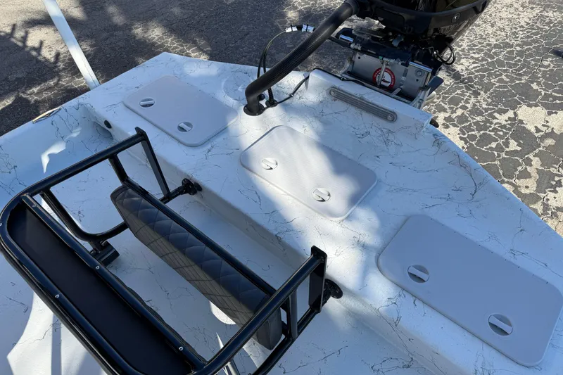 Slide: The Image of 2022 Shoalwater 23 Catamaran boat deck with storage compartments and seating. - 30