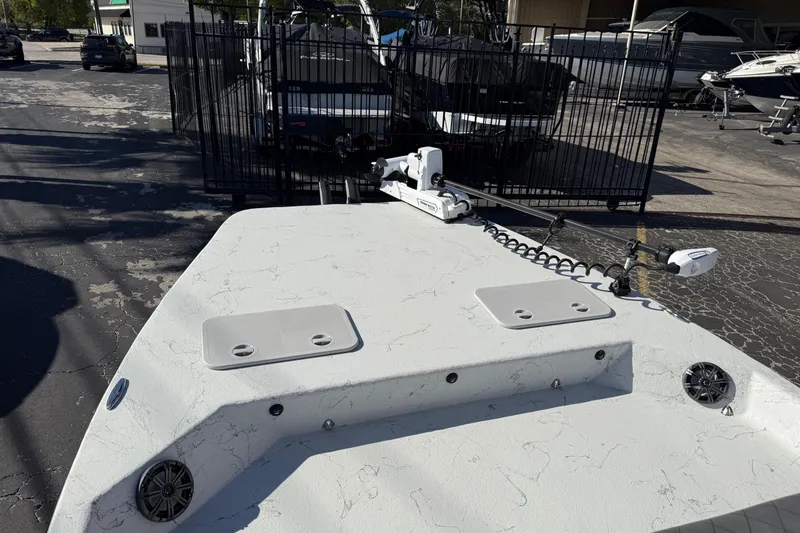 Slide: The Image of 2022 Shoalwater 23 Catamaran boat deck with trolling motor in a marina setting. - 32