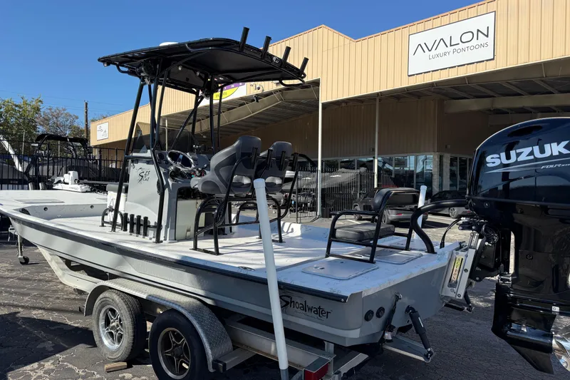 Slide: The Image of 2022 Shoalwater 23 Catamaran boat with Suzuki engine at Avalon Luxury Pontoons dealership. - 4