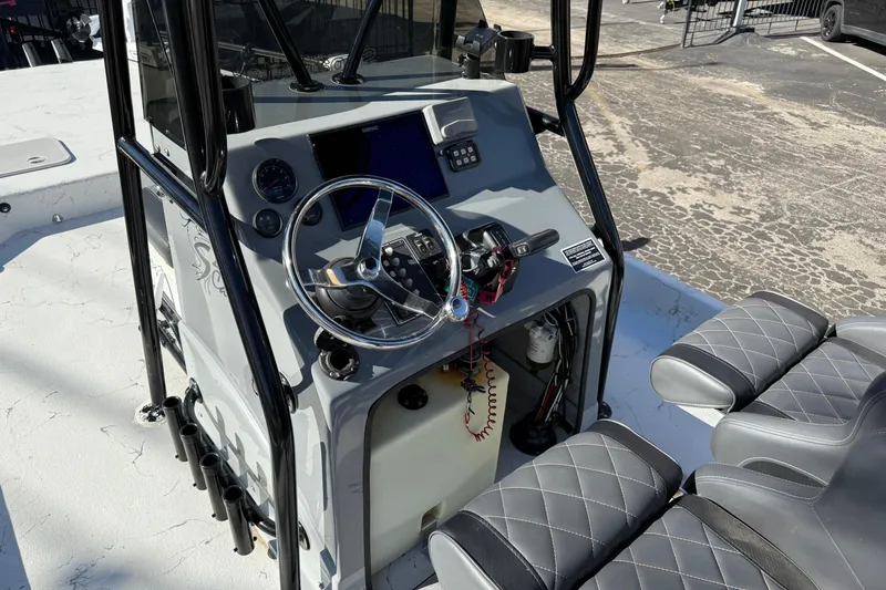 Slide: The Image of 2022 Shoalwater 23 Catamaran cockpit with steering wheel and controls. - 9
