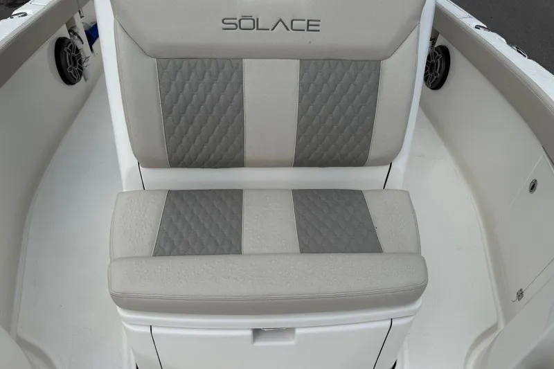 Slide: The Image of 2025 Solace 28 HCS boat seat with gray and beige upholstery. - 19
