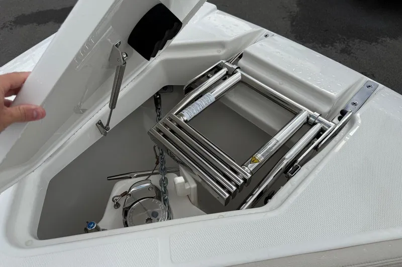 Slide: The Image of Open hatch of 2025 Solace 28 HCS boat showing stainless steel ladder and anchor storage. - 21