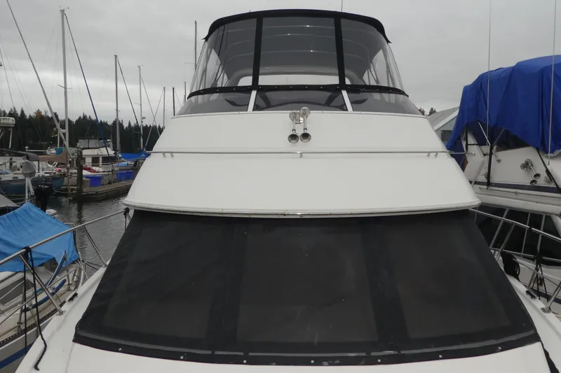 Slide: The Image of 2006 Carver 366 Motor Yacht docked at marina, front view. - 2