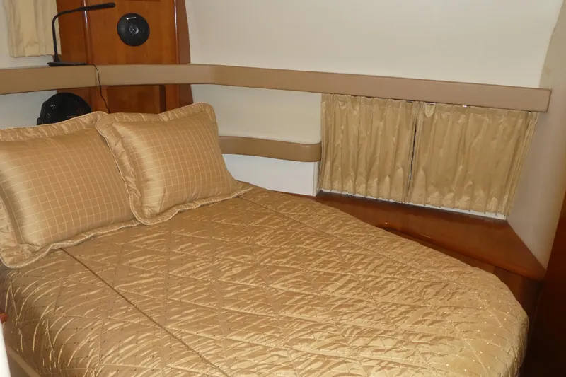 Slide: The Image of Luxurious cabin interior of 2006 Carver 366 Motor Yacht with elegant bedding. - 29