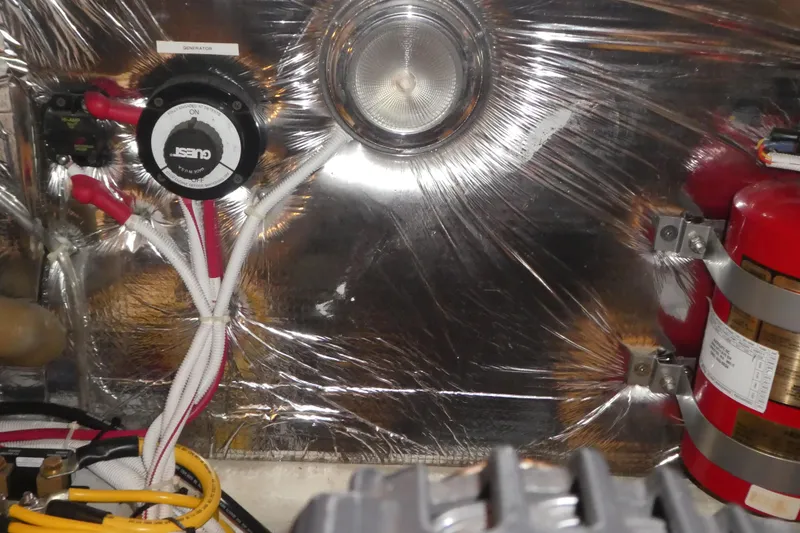 Slide: The Image of Engine room of 2006 Carver 366 Motor Yacht with wiring and fire extinguisher. - 47