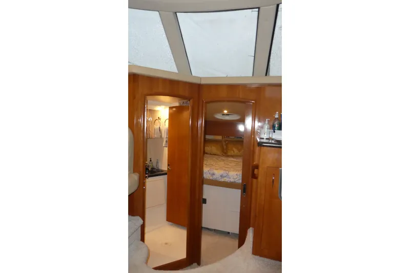 Slide: The Image of Interior of 2006 Carver 366 Motor Yacht with wood finish and cozy bedroom. - 21