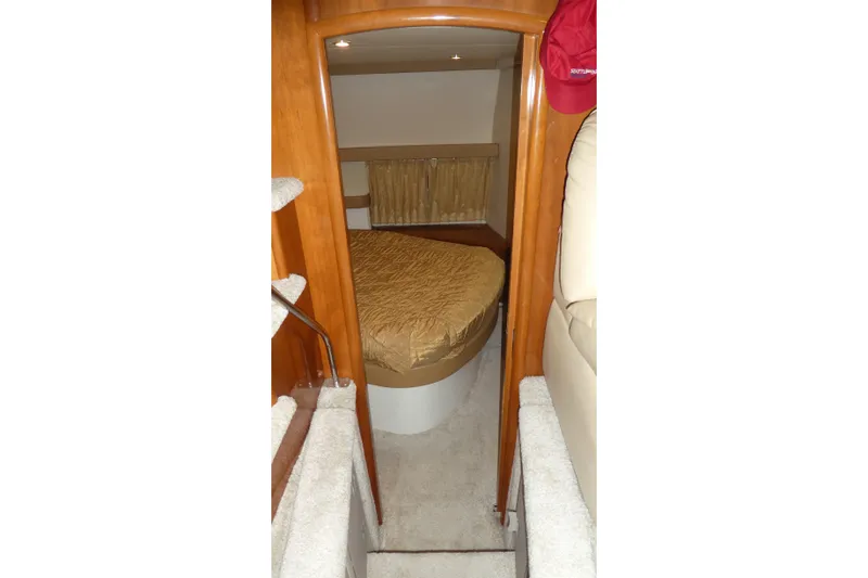 Slide: The Image of Interior of 2006 Carver 366 Motor Yacht with cozy bedroom and wooden accents. - 25