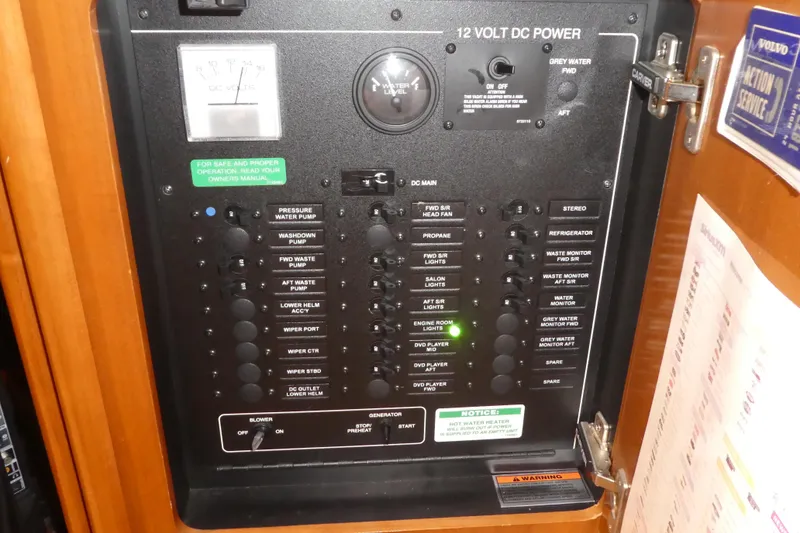Slide: The Image of Electrical control panel on a 2006 Carver 366 Motor Yacht, featuring various switches and indicators. - 41