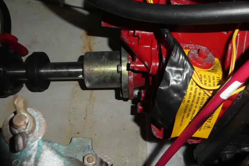 Slide: The Image of Engine component of a 2006 Carver 366 Motor Yacht, featuring red and metallic parts. - 45