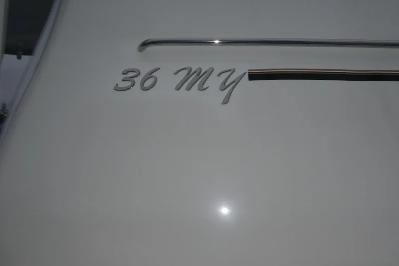 Slide: The Image of 2006 Carver 366 Motor Yacht exterior with "36 MY" emblem detail. - 51