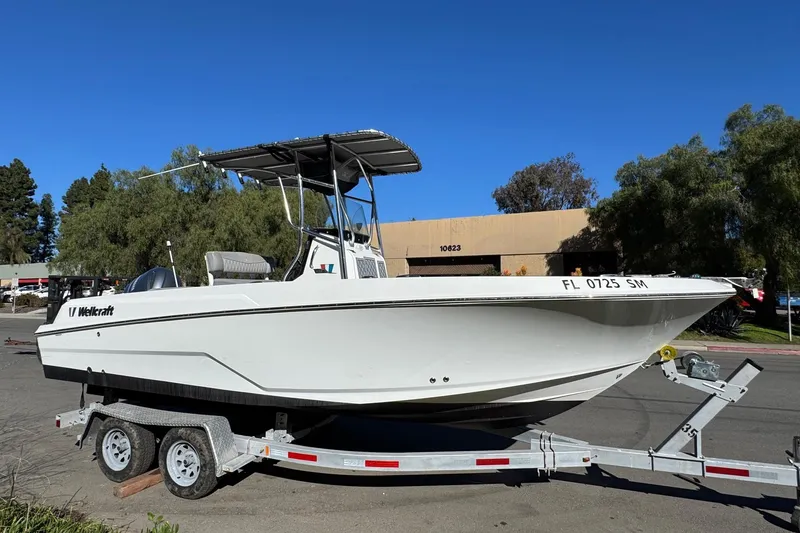 Slide: The Image of 2020 Wellcraft 222 Fisherman boat on trailer, parked outdoors. - 14