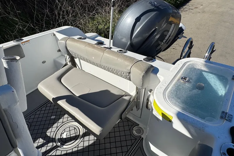 Slide: The Image of 2020 Wellcraft 222 Fisherman boat interior with seating and Yamaha outboard motor. - 29