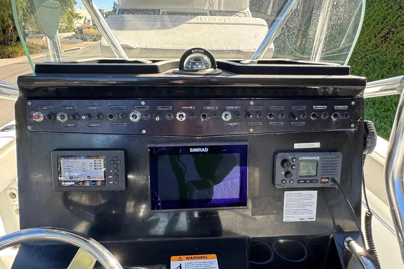 Slide: The Image of Control panel of a 2020 Wellcraft 222 Fisherman boat with navigation equipment. - 38