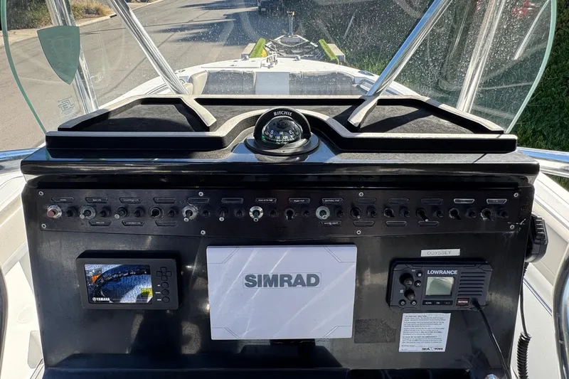 Slide: The Image of Control panel of a 2020 Wellcraft 222 Fisherman boat with navigation instruments. - 40