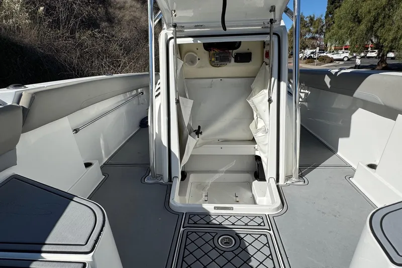 Slide: The Image of 2020 Wellcraft 222 Fisherman boat interior with open storage compartment. - 46