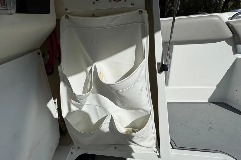 Slide: The Image of Interior storage pockets on a 2020 Wellcraft 222 Fisherman boat. - 48