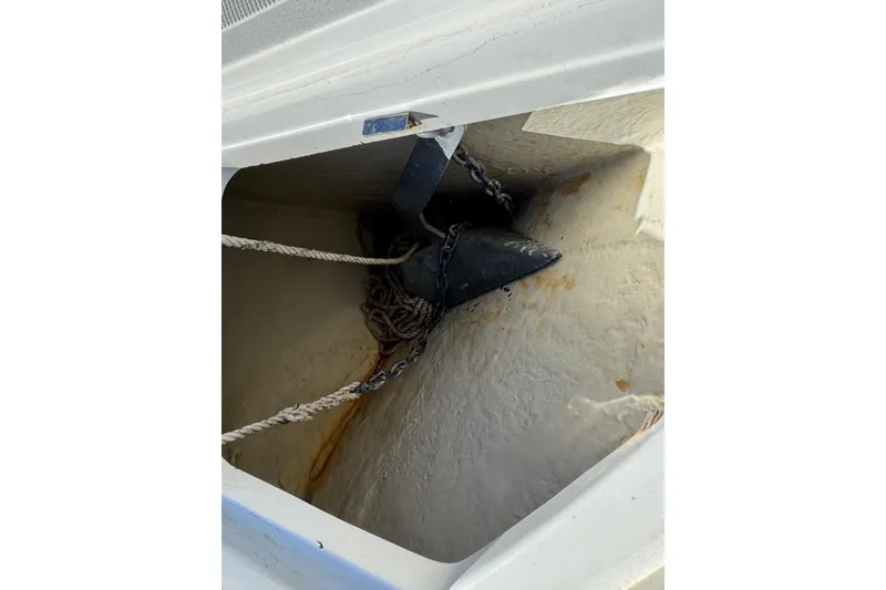 Slide: The Image of Anchor compartment of 2020 Wellcraft 222 Fisherman boat with rope and chain. - 56