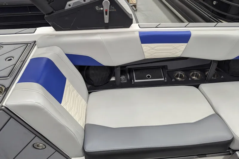 Slide: The Image of 2023 Malibu Wakesetter 25 LSV interior with blue and white seating. - 21