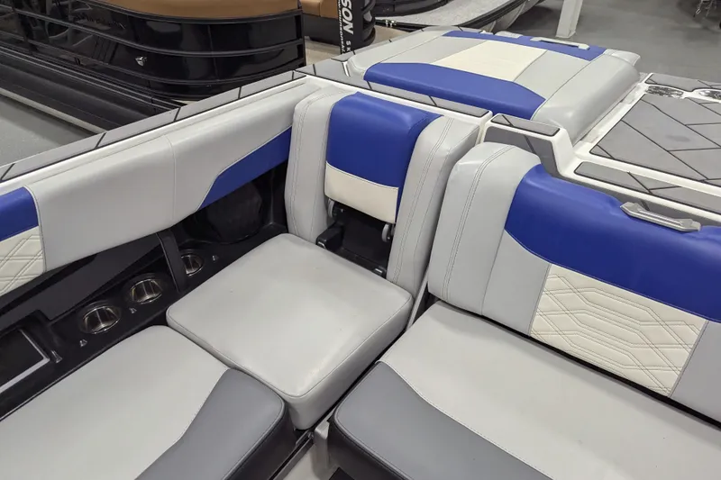 Slide: The Image of 2023 Malibu Wakesetter 25 LSV interior with blue and gray seating. - 22