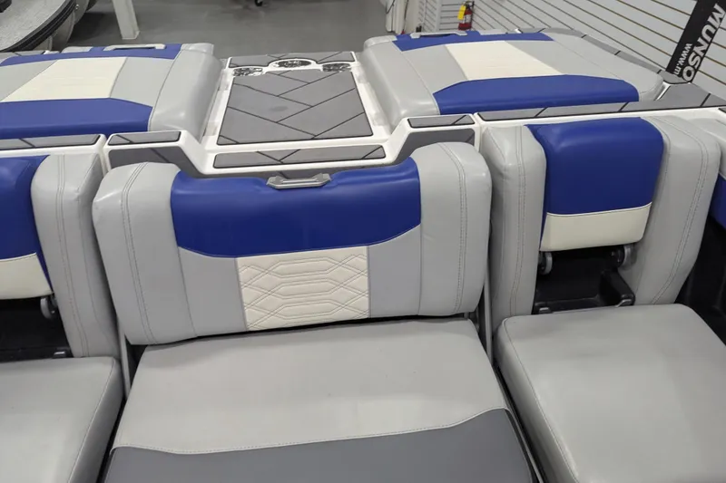 Slide: The Image of 2023 Malibu Wakesetter 25 LSV interior seating with blue and gray upholstery. - 23