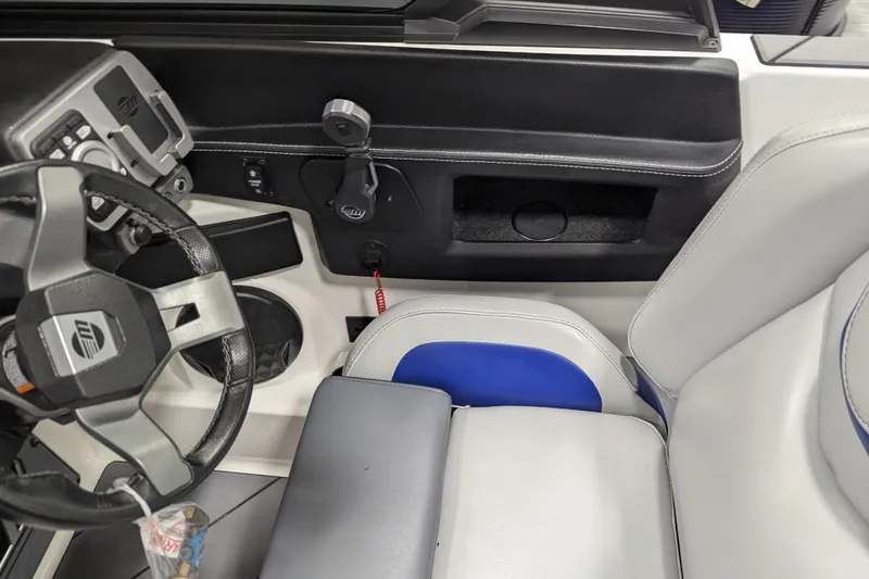 Slide: The Image of 2023 Malibu Wakesetter 25 LSV interior, featuring steering wheel and seating area. - 30