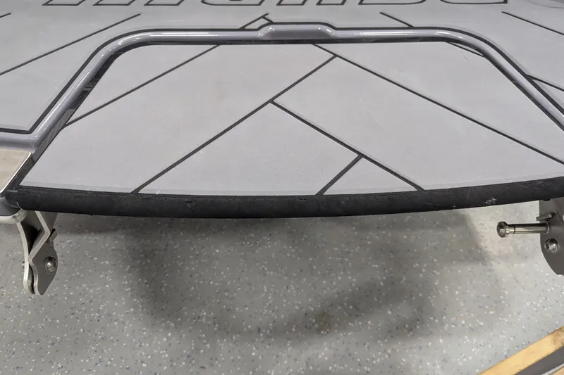 Slide: The Image of 2023 Malibu Wakesetter 25 LSV swim platform with textured surface and metal frame. - 35