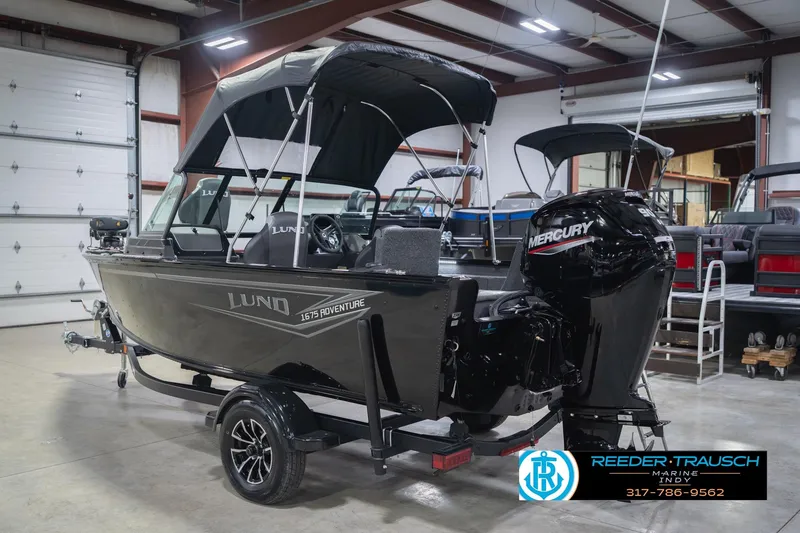 Slide: The Image of 2026 Lund 1675 Adventure Sport boat with Mercury engine in showroom. - 10