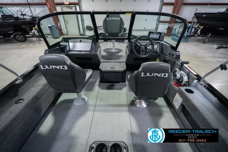 Slide: The Image of Interior view of 2026 Lund 1675 Adventure Sport boat with dual seats and steering console. - 16