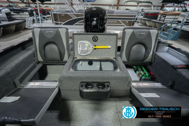 Slide: The Image of 2026 Lund 1675 Adventure Sport boat interior with seating and storage compartments. - 23