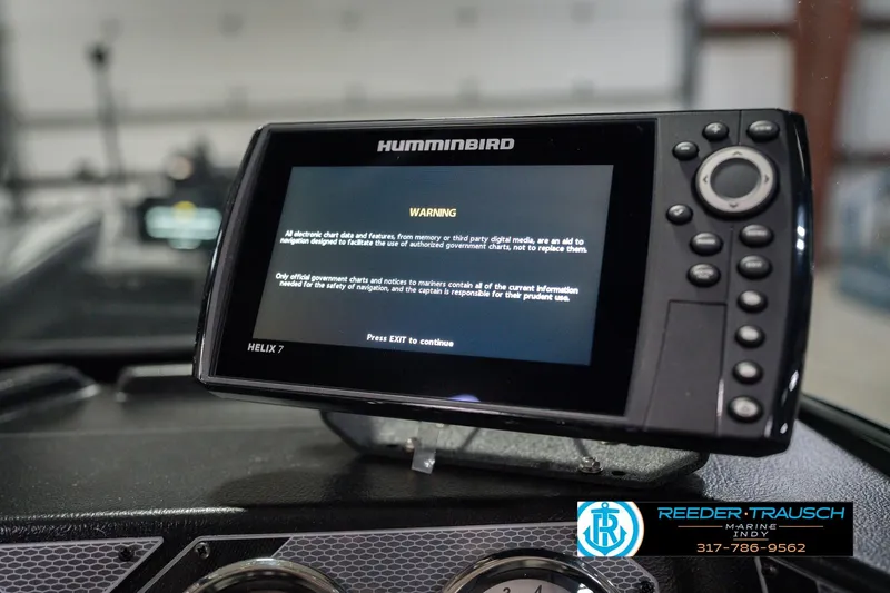 Slide: The Image of ```markdown Humminbird Helix 7 GPS on 2026 Lund 1675 Adventure Sport boat dashboard. ``` - 36