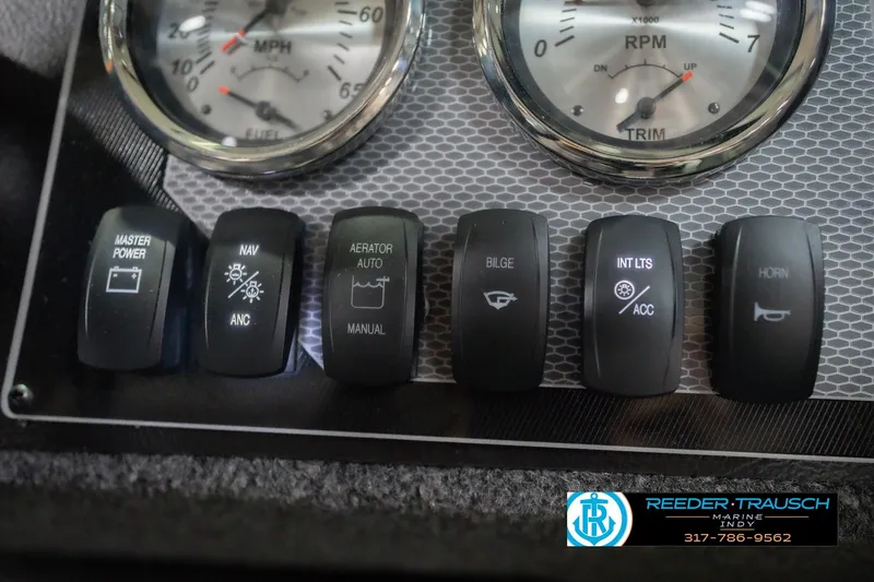 Slide: The Image of Dashboard controls of 2026 Lund 1675 Adventure Sport boat with gauges and switches. - 38