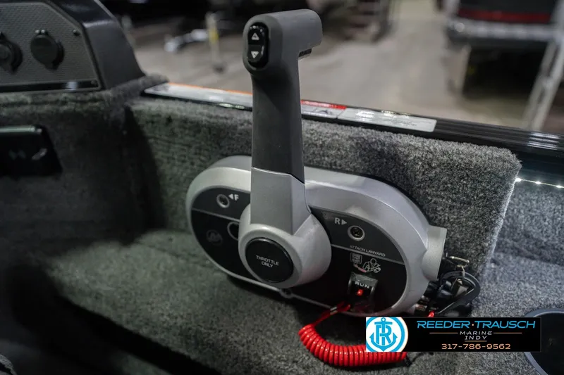 Slide: The Image of Throttle control of 2026 Lund 1675 Adventure Sport boat, featuring ergonomic design and safety lanyard. - 39