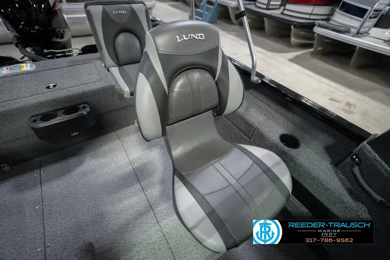 Slide: The Image of 2026 Lund 1675 Adventure Sport boat interior with gray seating and cup holders. - 42